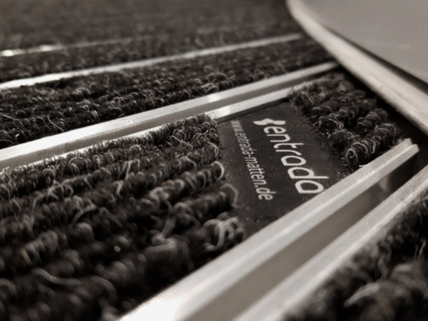 Detailaufnahme eine Eingangmattensystems mit entrada Label