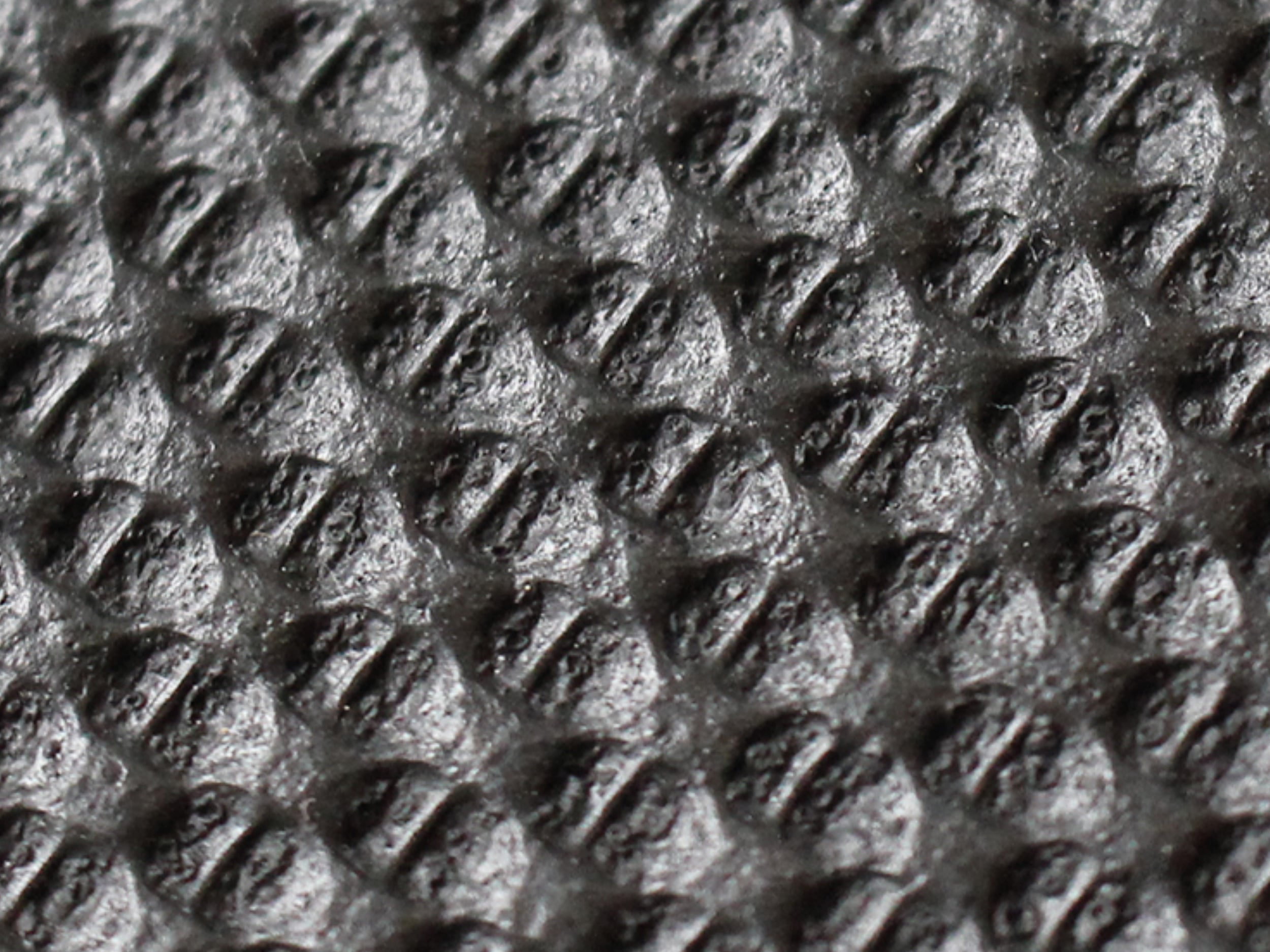 Nahaufnahme der strukturierten Gummioberfläche der Arbeitsplatzmatte Ergo Air