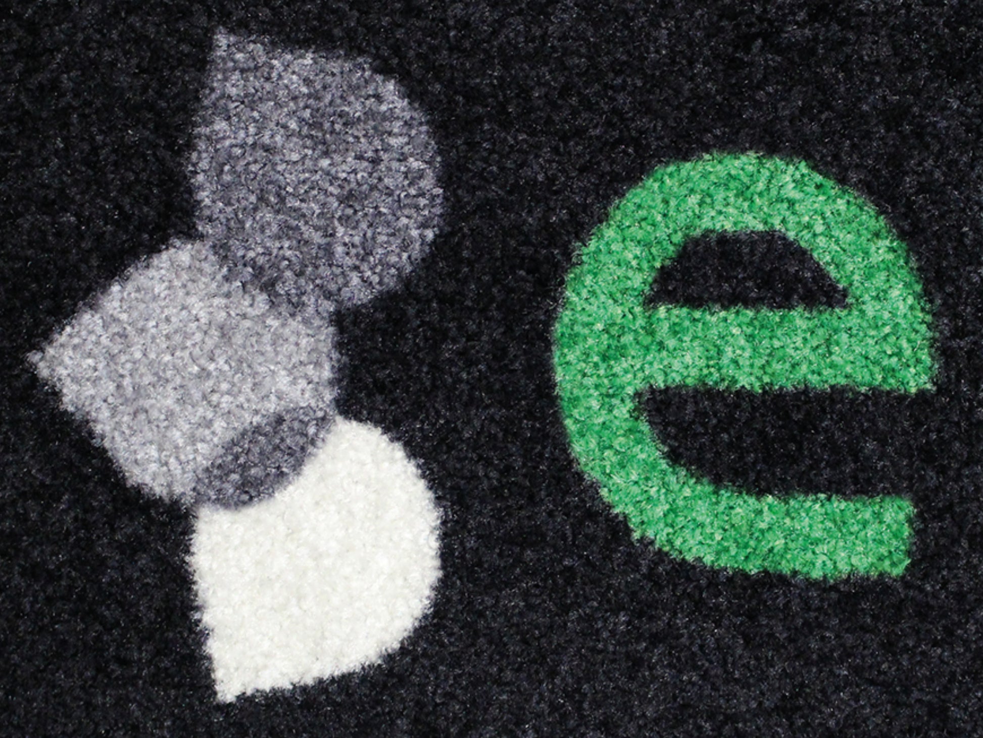 Nahaufnahme der Textur der Arbeitsplatzmatte Ergo Design mit Teppichoberfläche