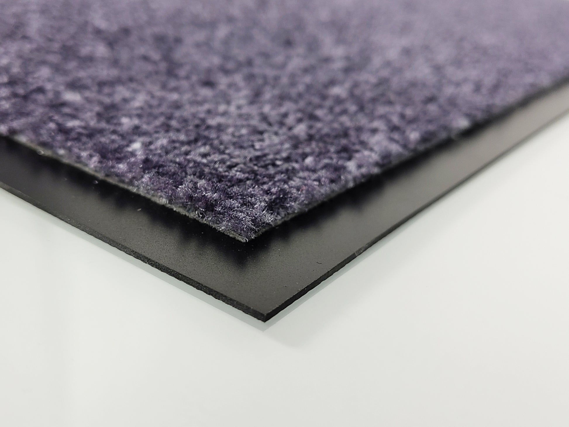 Nahaufnahme vom Rand einer bedruckten Fußmatte