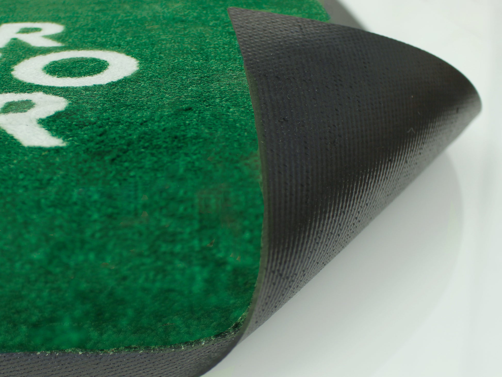 Gummi-Rückseite einer grüne Logomatte