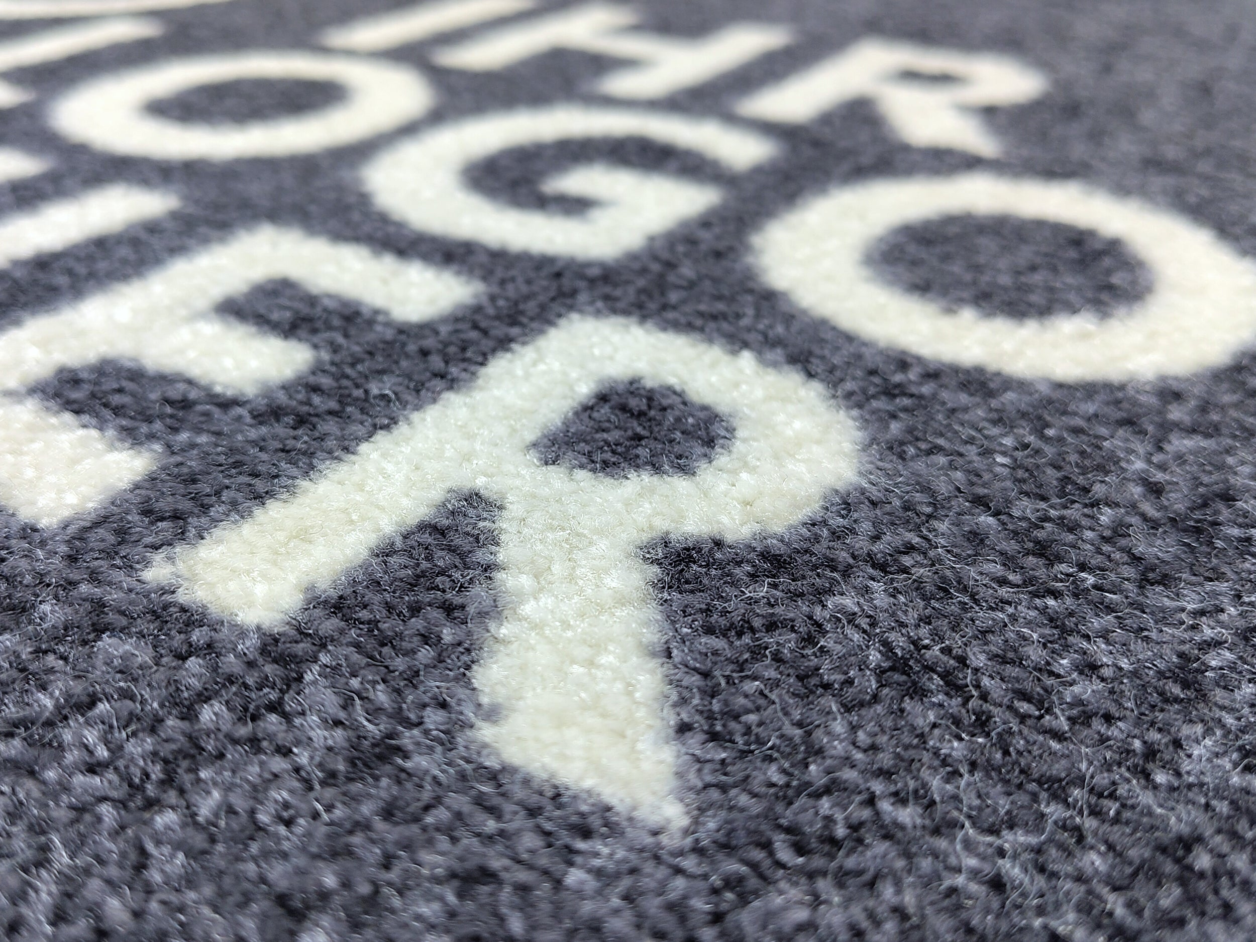 Nahaufnahme einer Logomatte mit dem Schriftzug: Ihr Logo hier