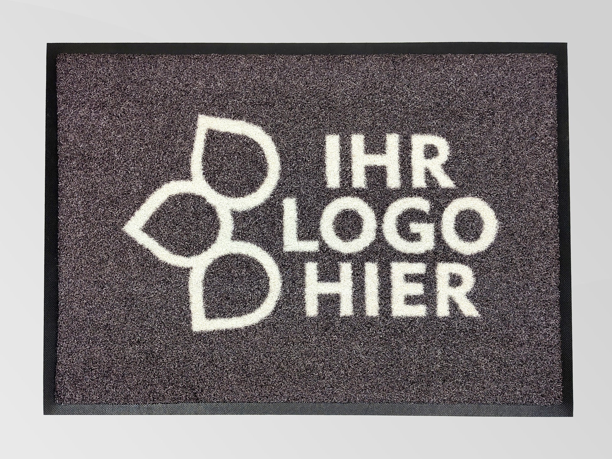 Eine grau melierte Matte von oben, auf der steht: Ihr Logo hier. 