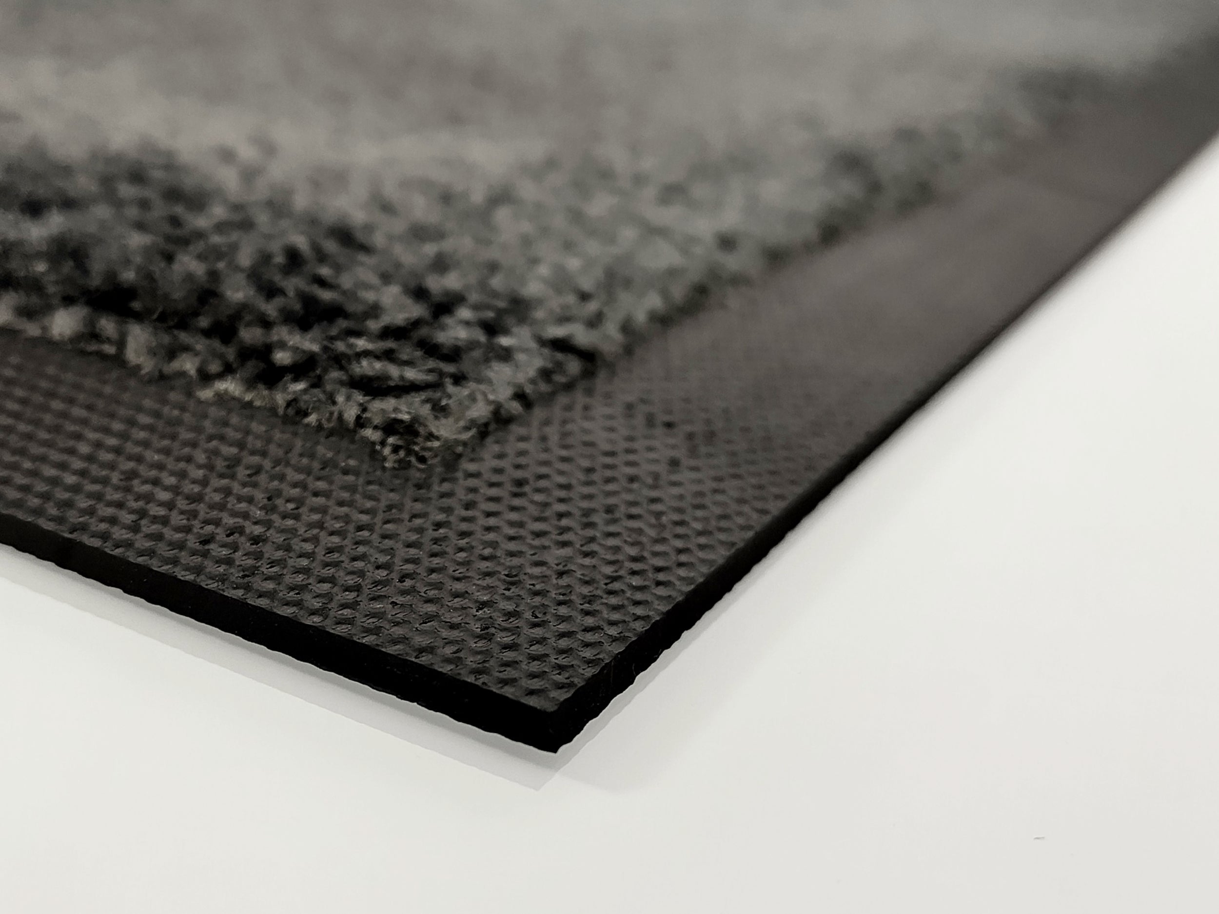 Rand einer grauen Fussmatte