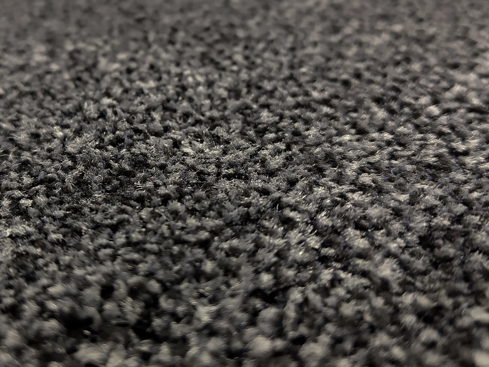 Nahaufnahme einer Schmutzfangmatte mit dunkelgrauen Floor