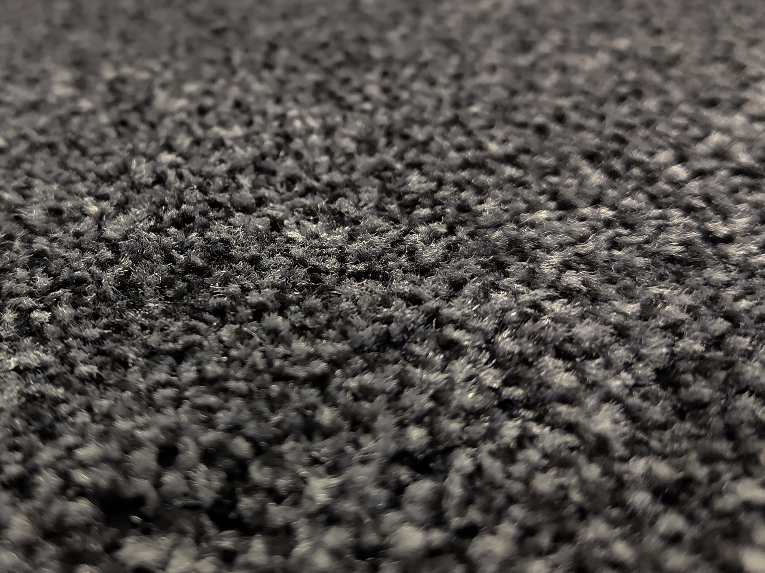 Nahaufnahme einer Schmutzfangmatte mit dunkelgrauen Floor