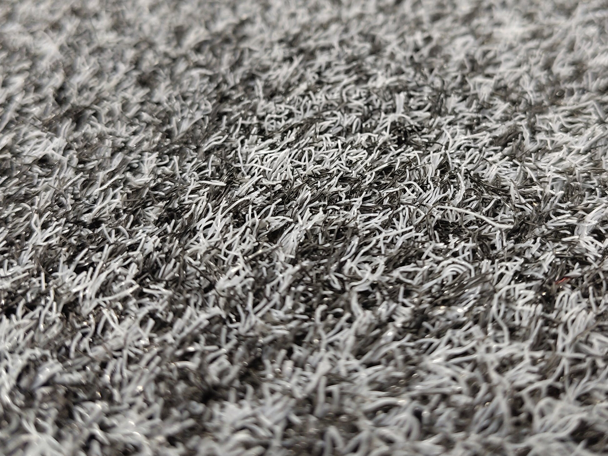 Nahaufnahme einer grau-melierten Outdoor Schmutzfangmatte mit recycelten Garn