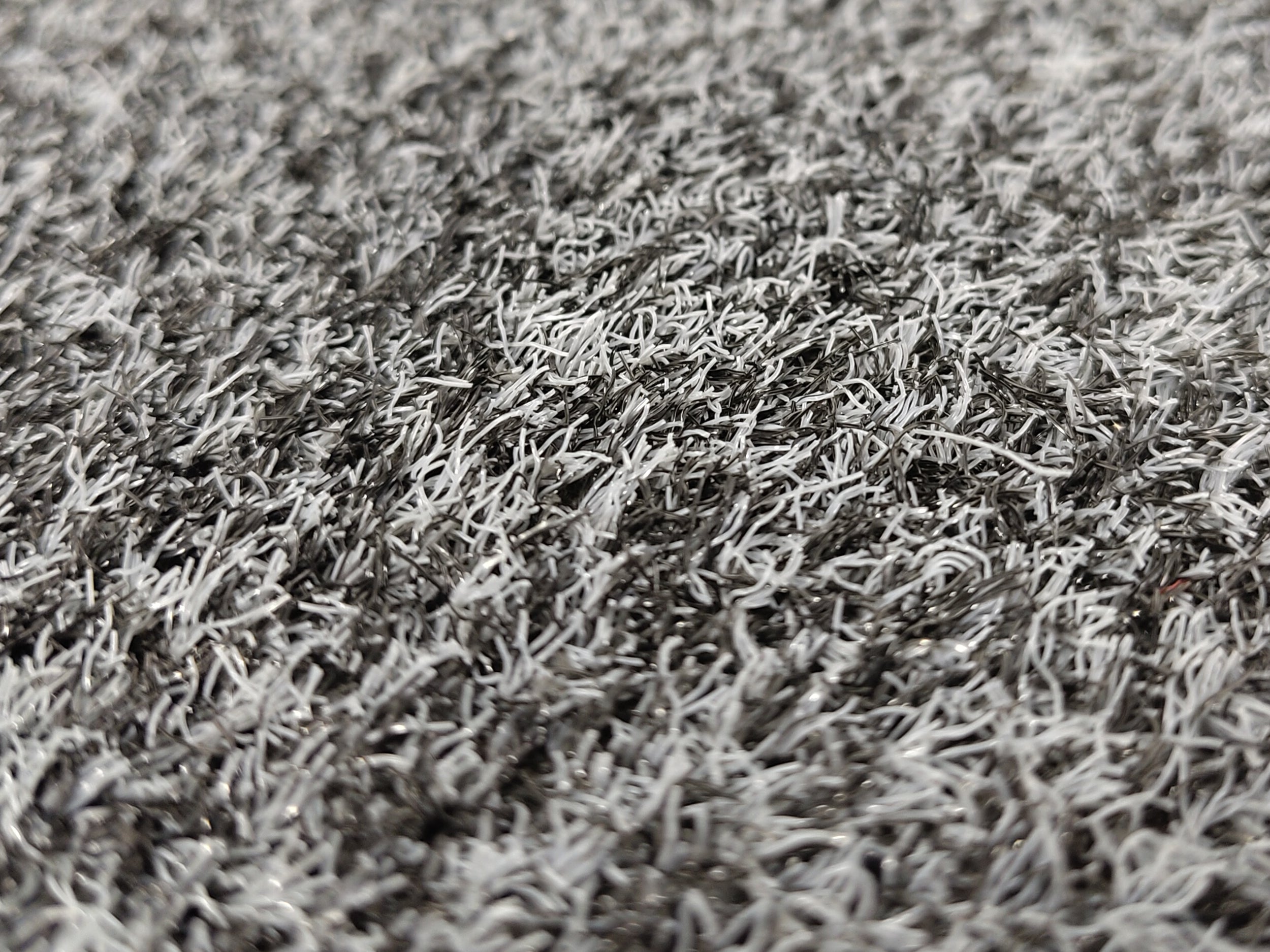 Nahaufnahme einer grau-melierten Outdoor Schmutzfangmatte mit recycelten Garn