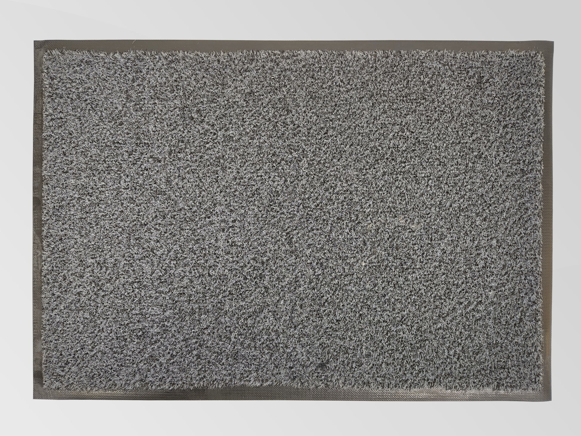 Graue Schmutzfangmatte aus recycelten Garn mit Rand von oben