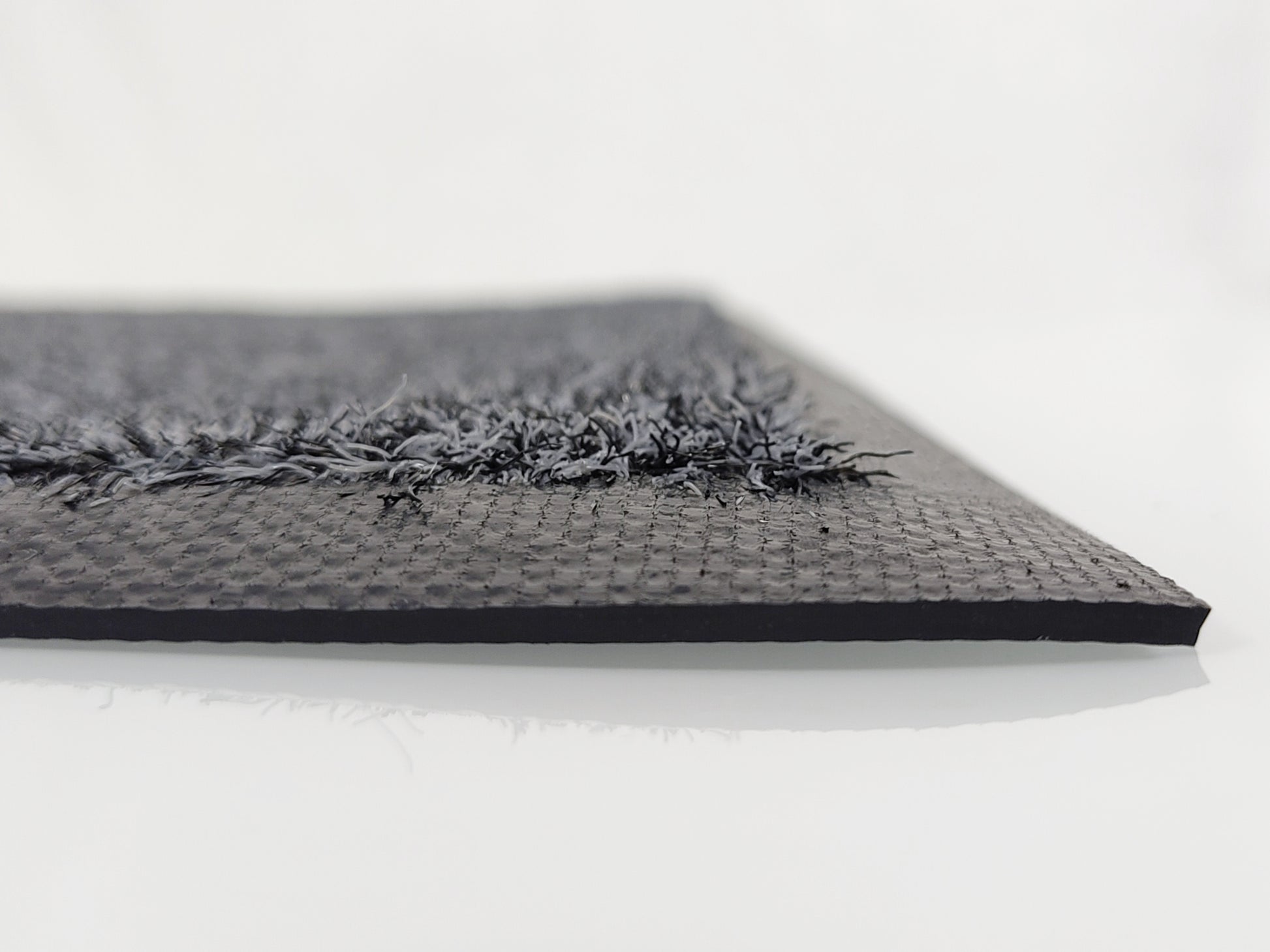 Profilaufnahme: Graue Schmutzfangmatte mit recycelten Garn und schwarzen Rand