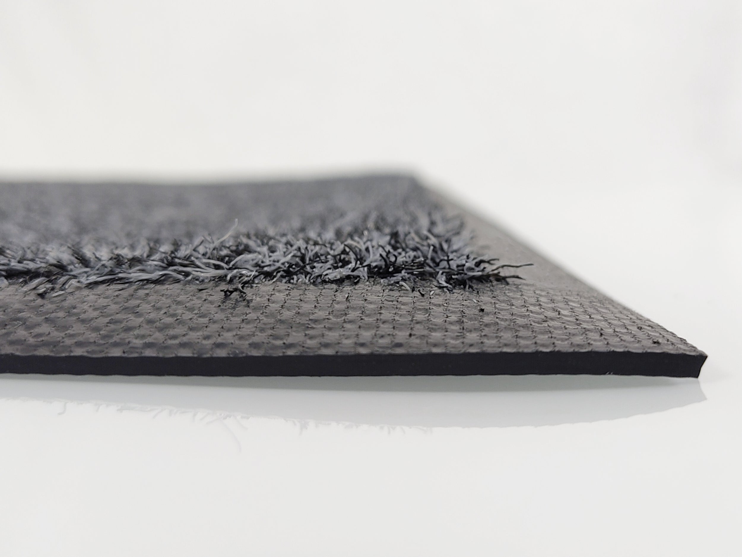 Profilaufnahme: Graue Schmutzfangmatte mit recycelten Garn und schwarzen Rand