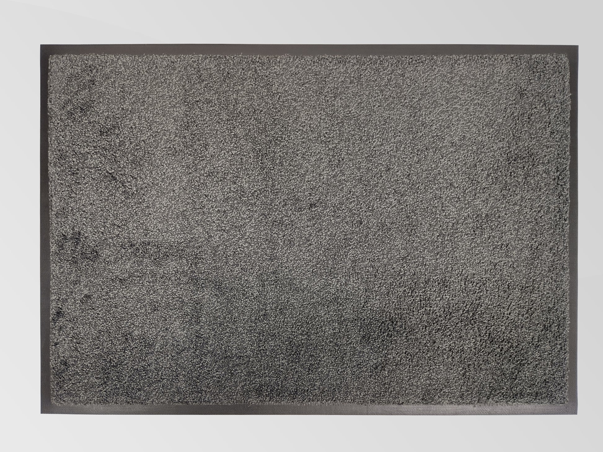 Graue Schmutzfangmatte mit Rand von oben fotografiert