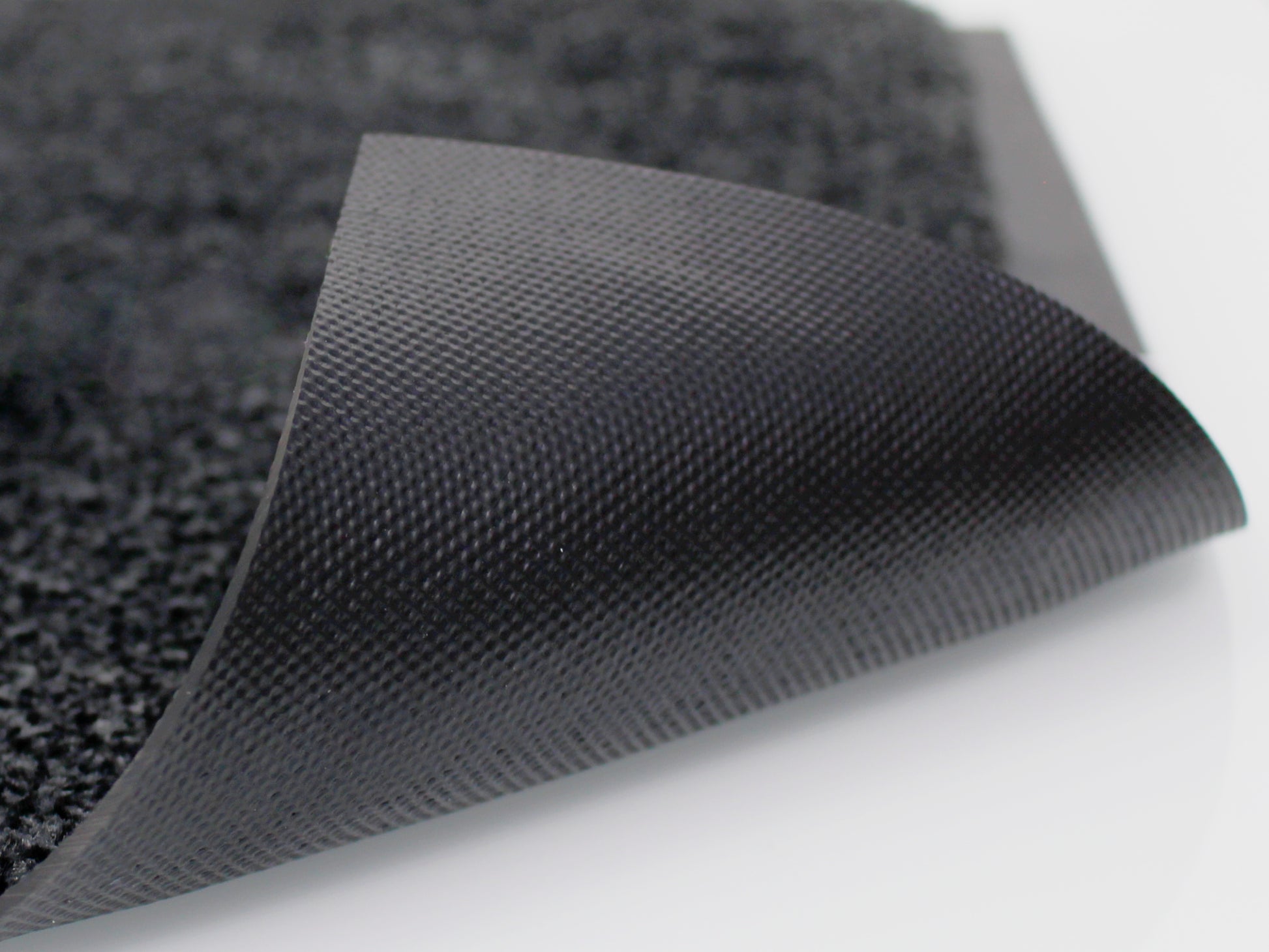 Umgeklappte graue Schmutzfangmatte mit schwarzen Nytrilgummi-Rückenmaterial