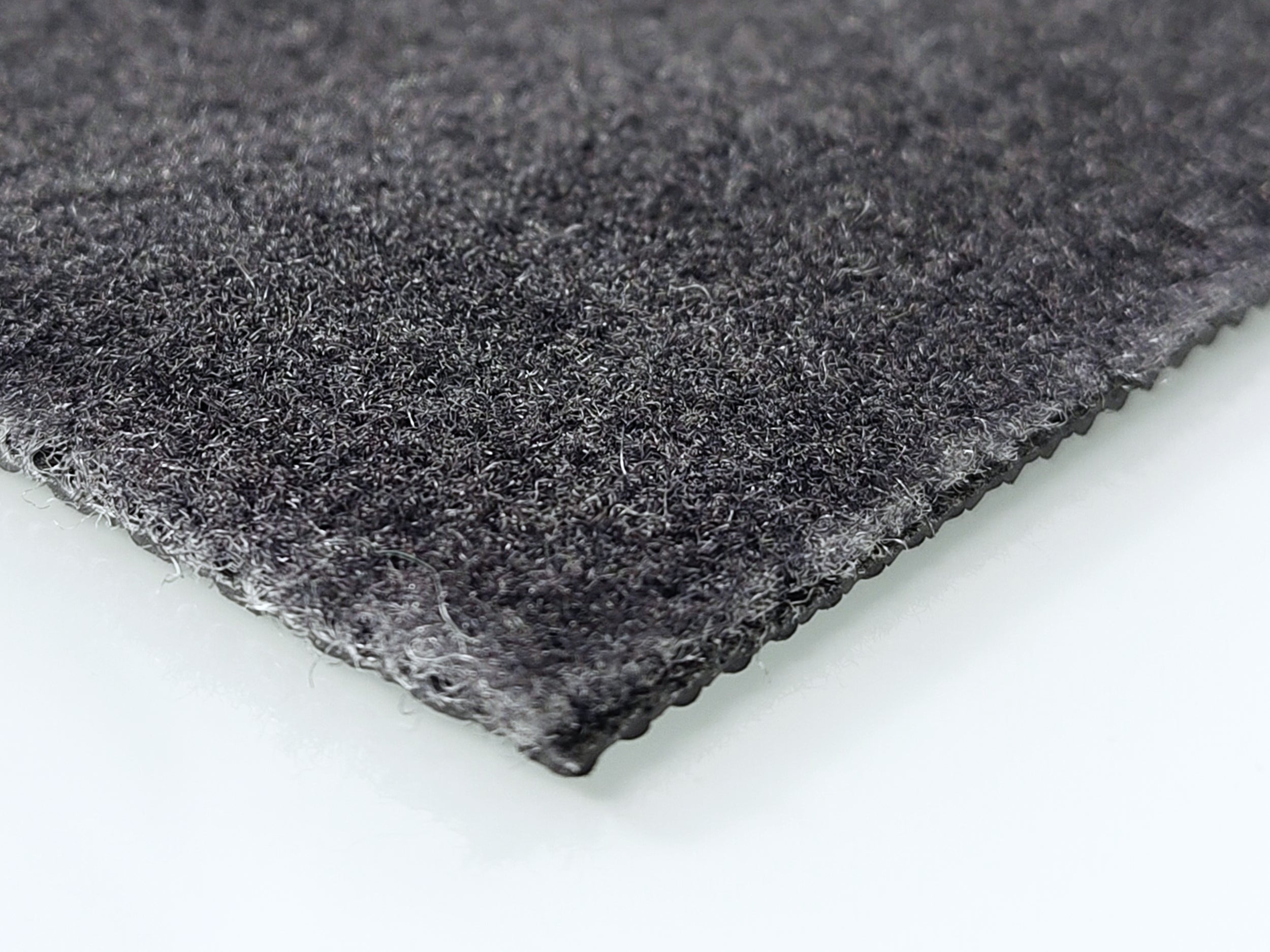 Ecke einer nachhaltigen, grauen Werbematte in Grau